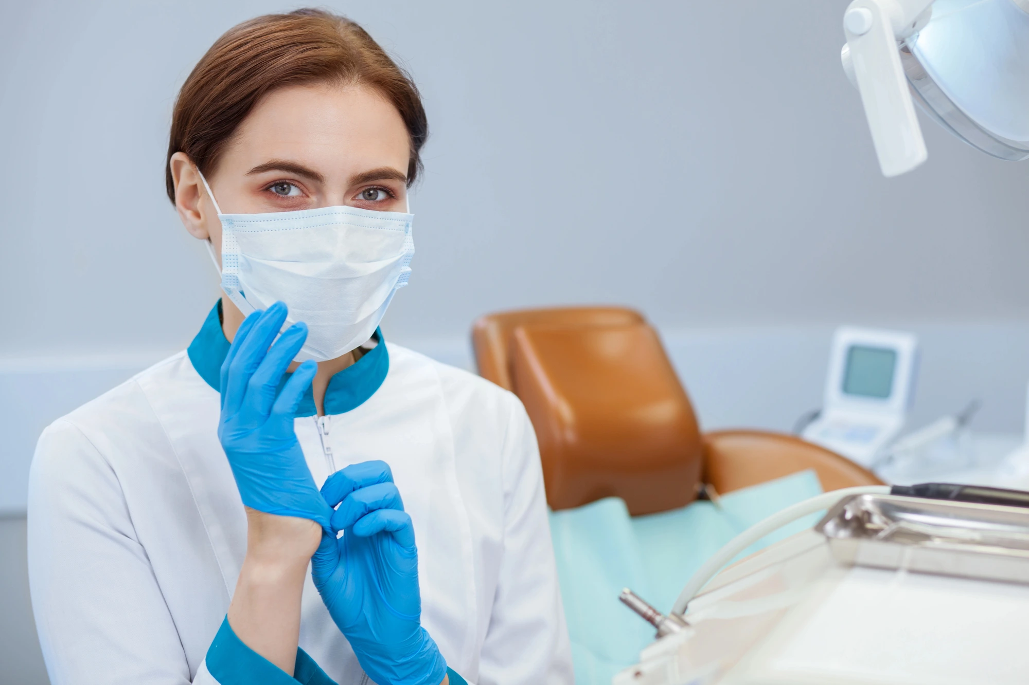 emergency dentist in Cary putting on gloves