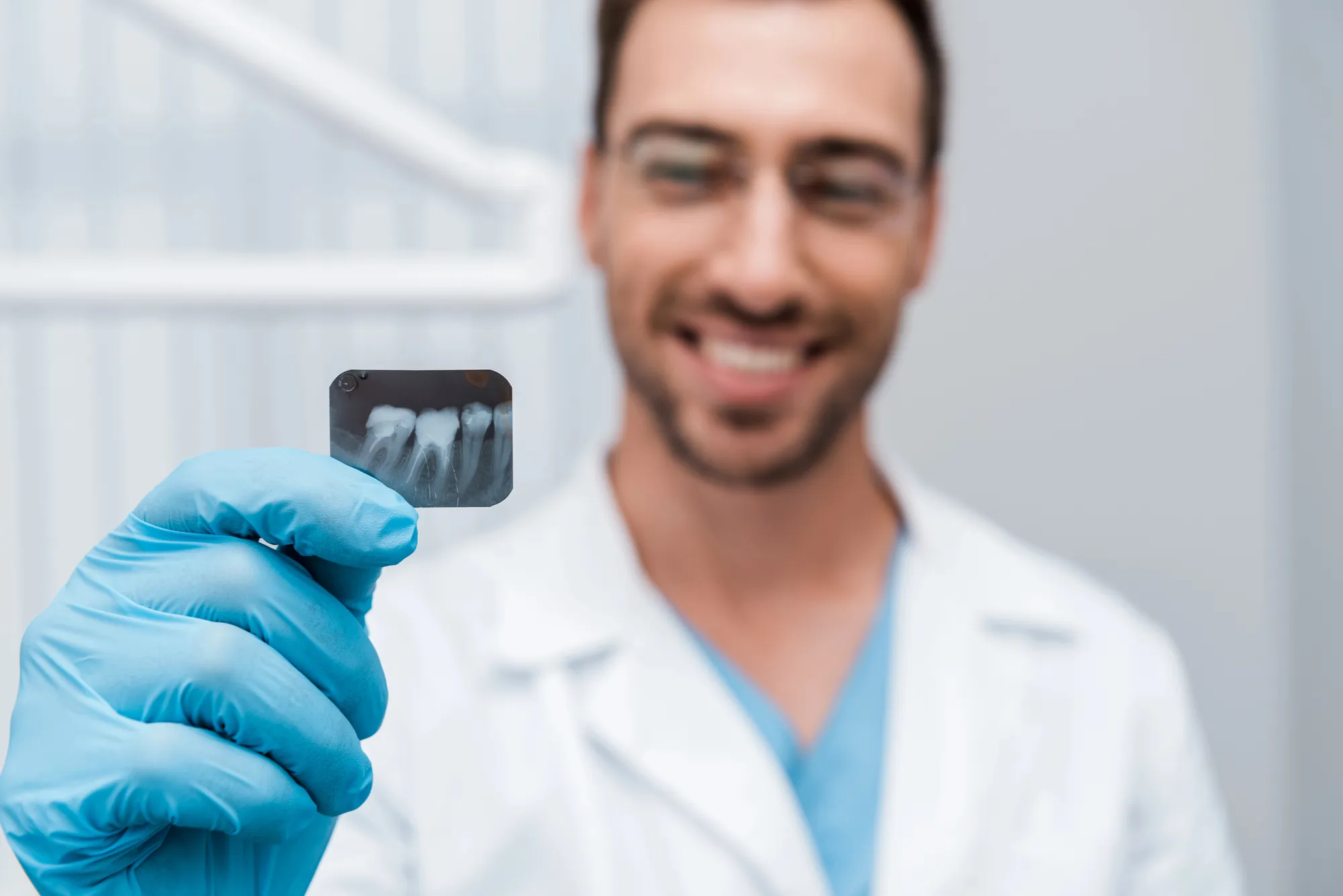 general dentist in Cary showing the camera a dental x-ray